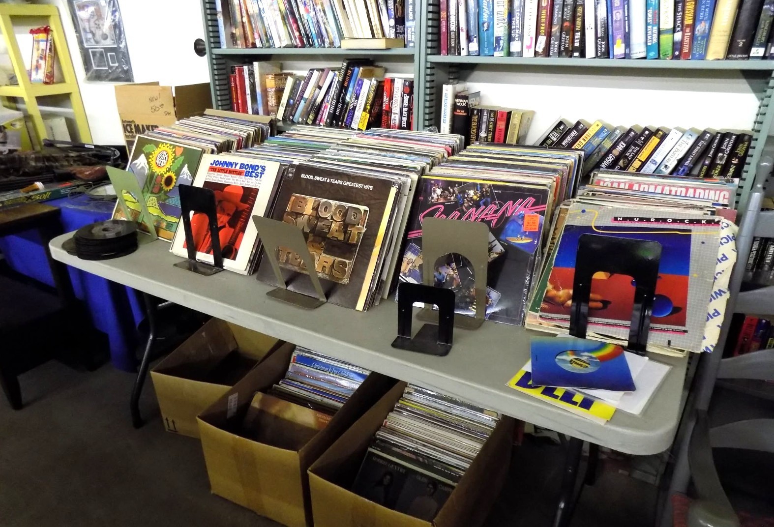 Vintage vinyl records and books at indoor vendor booth